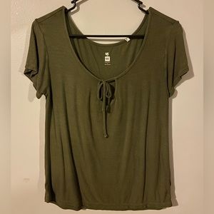 Olive green Me to We t-shirt. V cut along neck line with tie